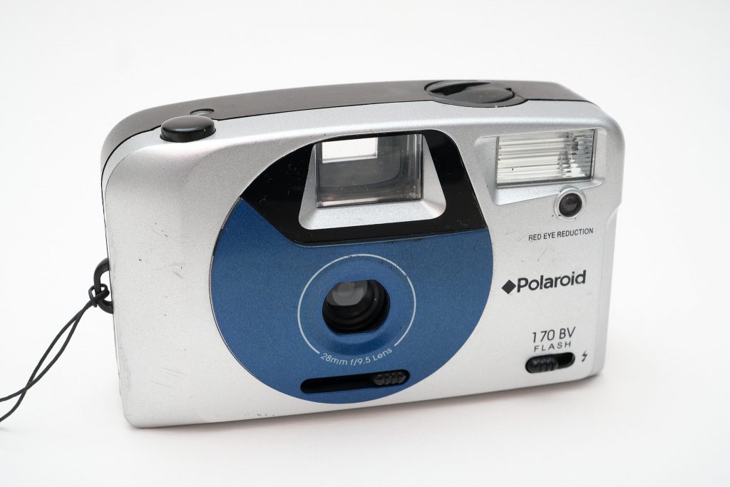 A picture of a basic point and shoot film camera from Polaroid