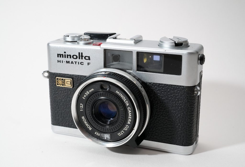 Front view of a small rangefinder camera from Minolta