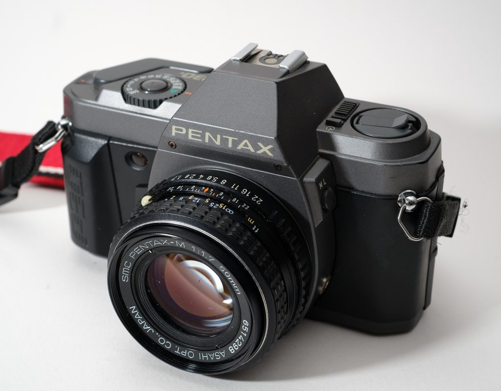 An image of the Pentax P30t film SLR with a lens attached